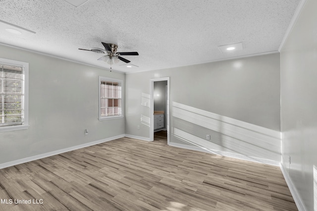 unfurnished room with light hardwood / wood-style flooring, a textured ceiling, plenty of natural light, and ceiling fan