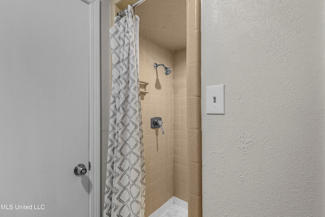 bathroom featuring walk in shower