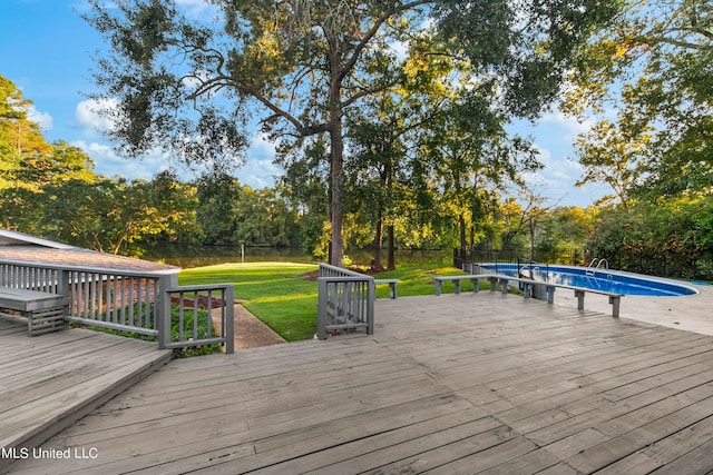 wooden deck featuring a yard