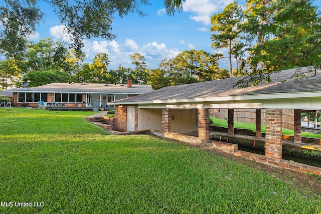 single story home featuring a front yard