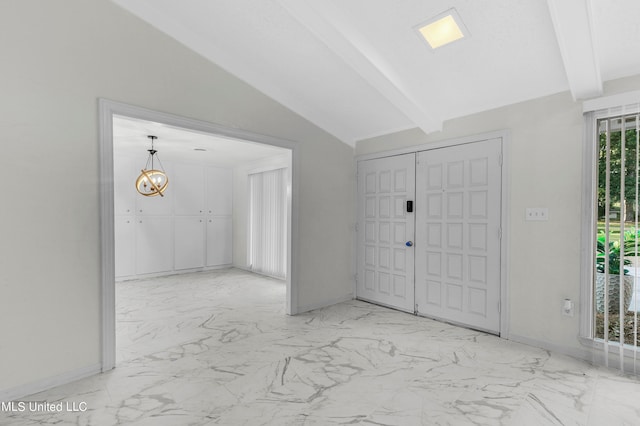 foyer featuring lofted ceiling with beams