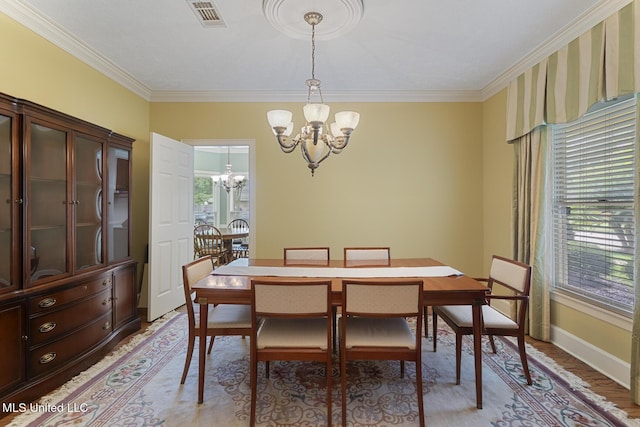 20 Peachtree Ln, Madison, MS 39110 - dining area featuring a chandelier, ornamental molding, and light wood-style flooring