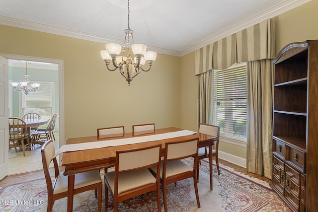 20 Peachtree Ln, Madison, MS 39110 - dining area featuring a chandelier, ornamental molding, and light wood-type flooring