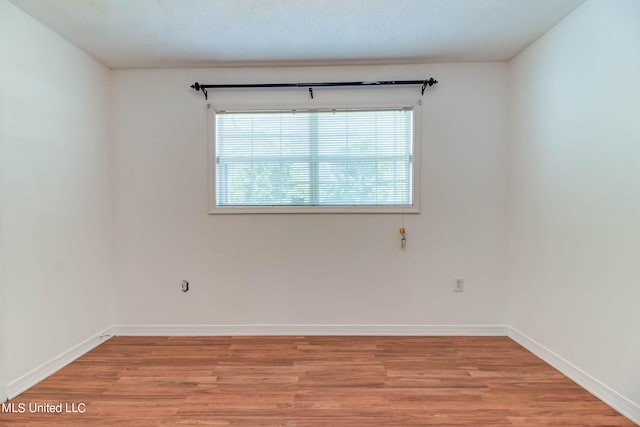 unfurnished room featuring light wood-type flooring