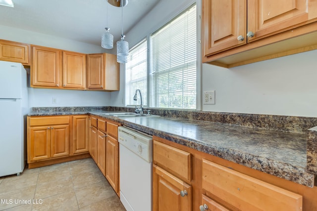 kitchen with light tile patterned floors, decorative light fixtures, sink, and white appliances