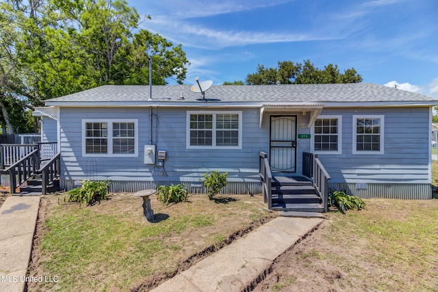 ranch-style house with a front lawn