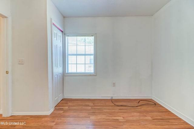 unfurnished room featuring light wood-type flooring