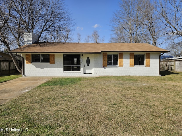 single story home featuring a front lawn, fence, brick siding, and a chimney