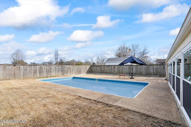 view of pool with a patio, a fenced backyard, a fenced in pool, and a lawn