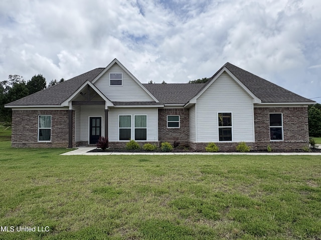 126 Deerfield Trce, Coldwater, MS 38618 - craftsman inspired home featuring a front yard, brick siding, and a shingled roof