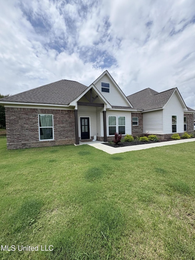 126 Deerfield Trce, Coldwater, MS 38618 - craftsman house with brick siding, a front lawn, and roof with shingles