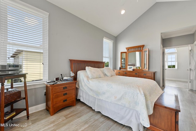 7101 Belle Fontaine Dr, Ocean Springs, MS 39564 - bedroom with high vaulted ceiling and light wood-type flooring