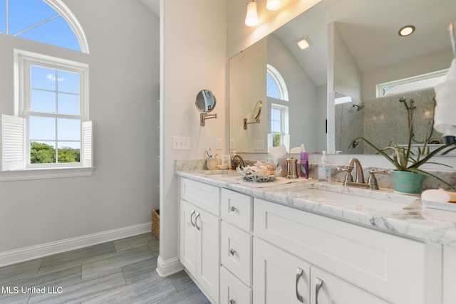 7101 Belle Fontaine Dr, Ocean Springs, MS 39564 - full bath with plenty of natural light, double vanity, a marble finish shower, and lofted ceiling