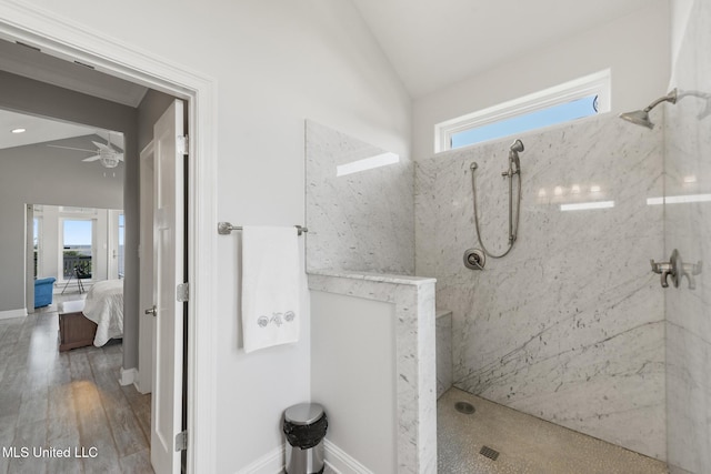 7101 Belle Fontaine Dr, Ocean Springs, MS 39564 - bathroom featuring vaulted ceiling, a tile shower, plenty of natural light, ceiling fan, and ensuite bathroom