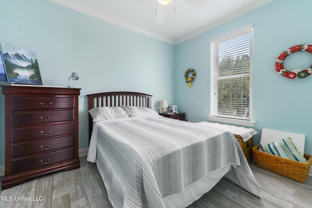 7101 Belle Fontaine Dr, Ocean Springs, MS 39564 - bedroom featuring crown molding, wood finished floors, and a ceiling fan