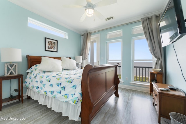 7101 Belle Fontaine Dr, Ocean Springs, MS 39564 - bedroom featuring ornamental molding, wood finished floors, and a ceiling fan