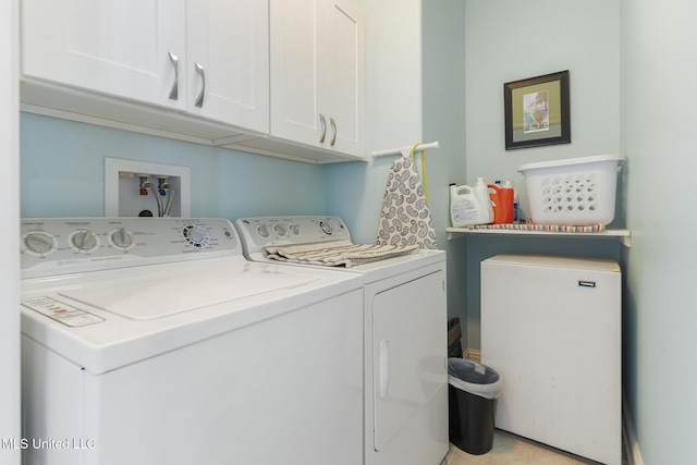 7101 Belle Fontaine Dr, Ocean Springs, MS 39564 - laundry area featuring separate washer and dryer and cabinet space