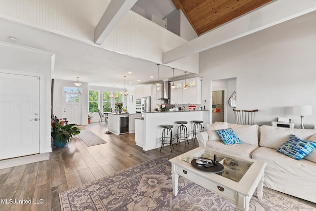 7101 Belle Fontaine Dr, Ocean Springs, MS 39564 - living room with a chandelier, high vaulted ceiling, wood finished floors, beverage cooler, and wooden ceiling
