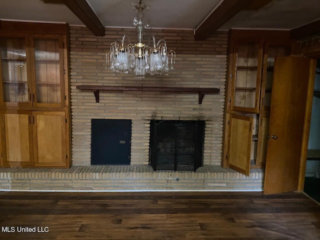 details with beamed ceiling, wood-type flooring, and a fireplace