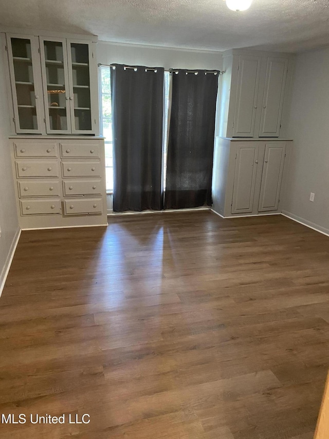 102 Brooklyn Dr, Natchez, MS 39120 - unfurnished dining area with wood finished floors and a textured ceiling