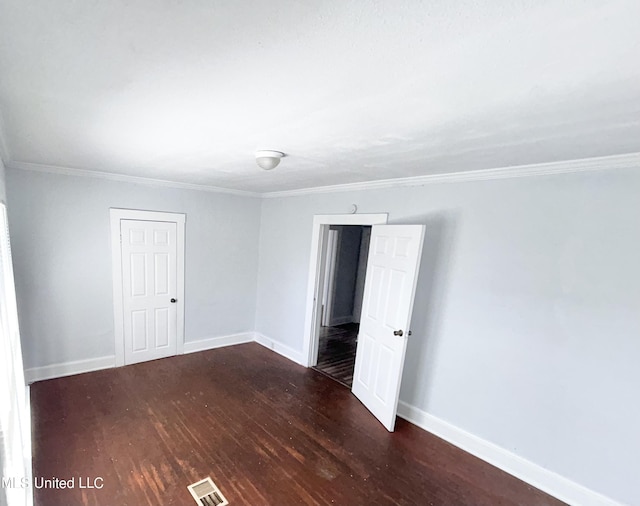 1004 Spengler St, Jackson, MS 39202 - unfurnished room featuring wood finished floors, baseboards, and crown molding