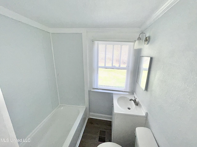 1004 Spengler St, Jackson, MS 39202 - full bath featuring a sink, toilet, a textured wall, and crown molding