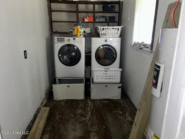 clothes washing area with separate washer and dryer and water heater