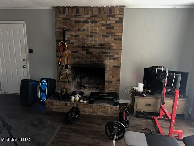 living room featuring a brick fireplace