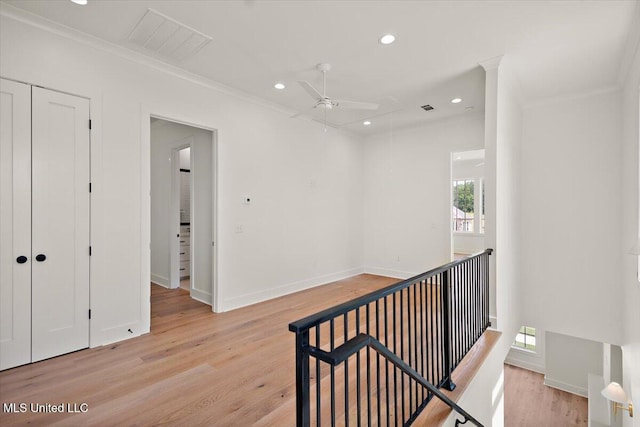 125 Water St, Madison, MS 39110 - hall with healthy amount of natural light, recessed lighting, light wood-style flooring, ornamental molding, and an upstairs landing