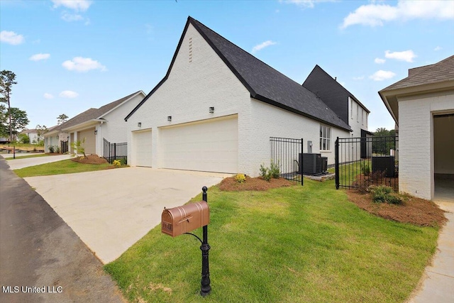 125 Water St, Madison, MS 39110 - view of side of home with a gate and concrete driveway