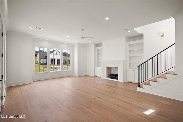 125 Water St, Madison, MS 39110 - unfurnished living room with ceiling fan, light wood-style flooring, recessed lighting, a fireplace, and built in features