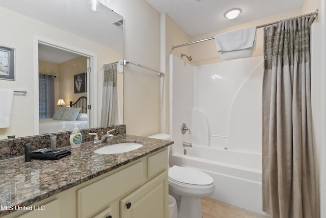 full bathroom featuring tile patterned flooring, vanity, toilet, and shower / tub combo