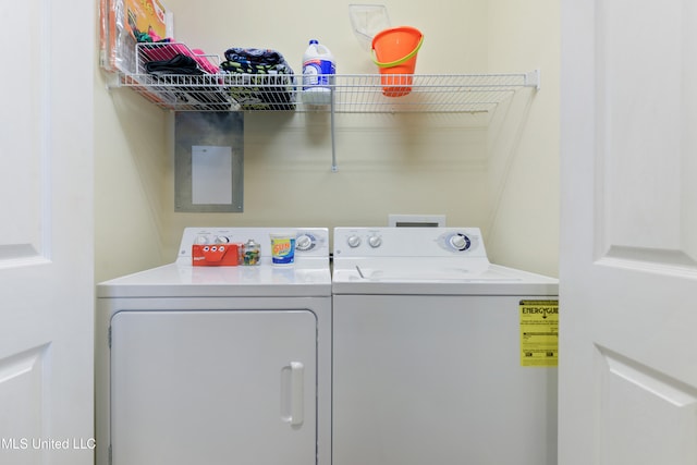 laundry area with washing machine and clothes dryer