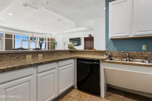 kitchen featuring dishwasher, white cabinets, a textured ceiling, and sink