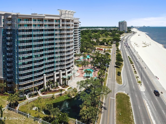 bird's eye view with a water view and a view of the beach