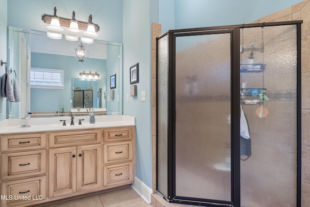 bathroom featuring a shower stall, vanity, and tile patterned floors