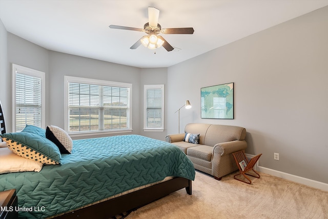 bedroom featuring a ceiling fan, carpet, and baseboards