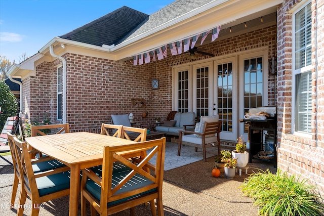 view of patio featuring french doors, outdoor dining area, and an outdoor hangout area