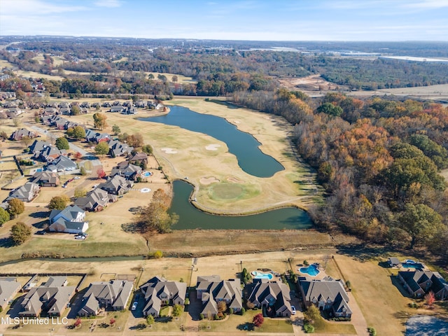 drone / aerial view with a water view and a residential view