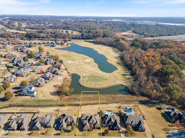 drone / aerial view featuring a water view and a residential view