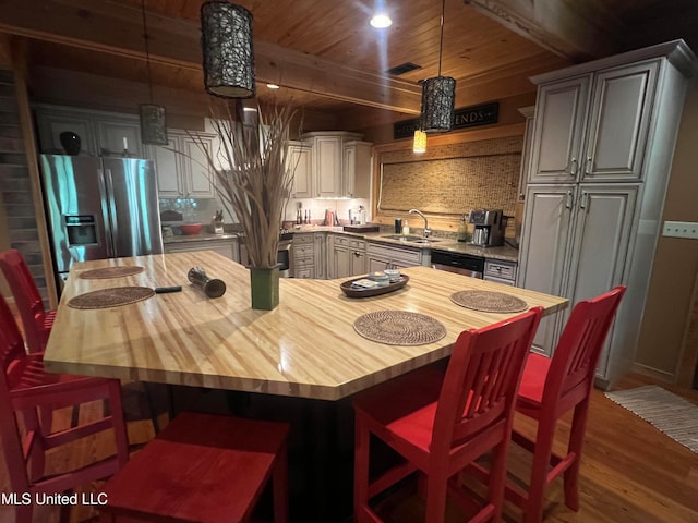 dining room with wooden ceiling, sink, and dark hardwood / wood-style floors