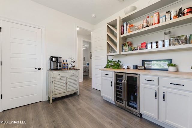 2918 Juliette Dr, Ocean Springs, MS 39564 - indoor dry bar featuring beverage cooler and wood finished floors