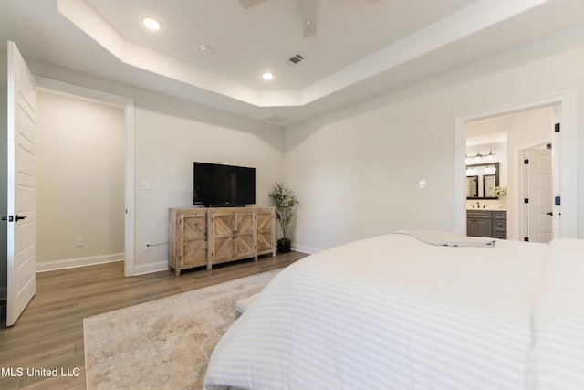 2918 Juliette Dr, Ocean Springs, MS 39564 - bedroom featuring wood finished floors, baseboards, recessed lighting, a tray ceiling, and a ceiling fan