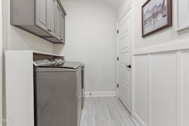 2918 Juliette Dr, Ocean Springs, MS 39564 - laundry area featuring washing machine and dryer, cabinet space, and baseboards