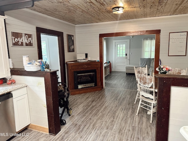 90 Holmes St, Lucedale, MS 39452 - dining space featuring wooden walls, wood ceiling, and wood finished floors