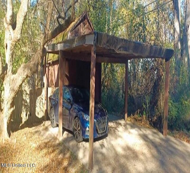 view of outbuilding with a carport