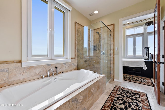 ensuite bathroom featuring a ceiling fan, a shower stall, a bath, and ensuite bathroom