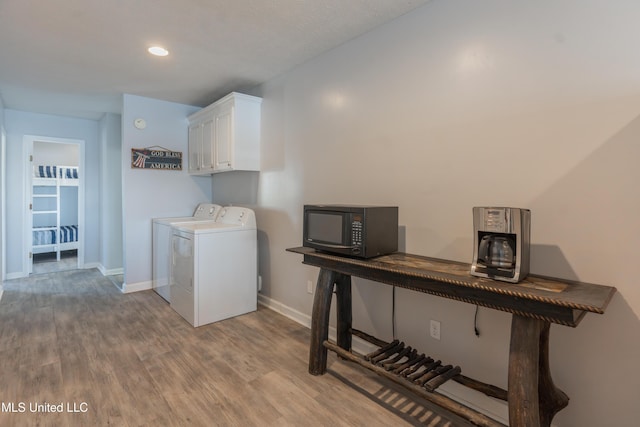 95 Nesting Site, Vicksburg, MS 39183 - laundry area with baseboards, cabinet space, wood finished floors, and washer and clothes dryer