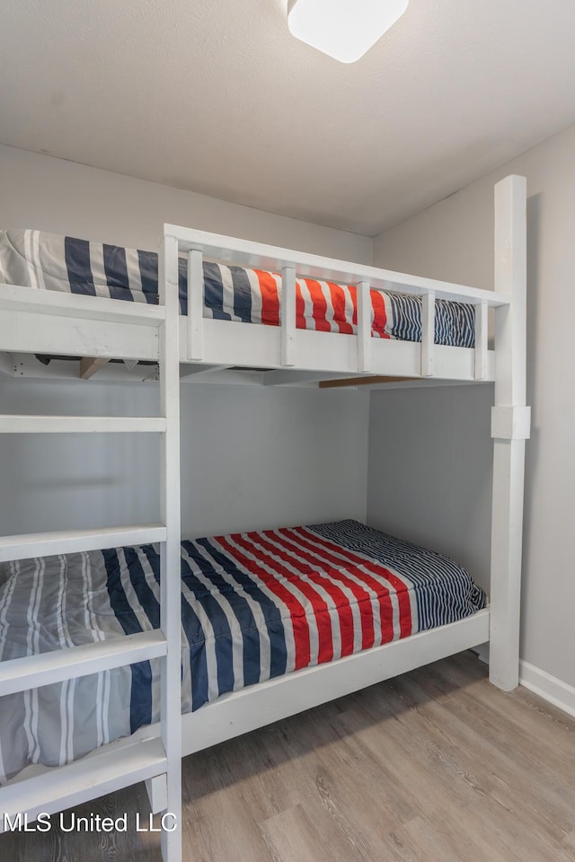 95 Nesting Site, Vicksburg, MS 39183 - bedroom featuring baseboards and wood finished floors