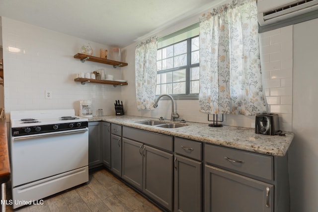 95 Nesting Site, Vicksburg, MS 39183 - kitchen featuring gray cabinets, a sink, an AC wall unit, white electric range, and backsplash